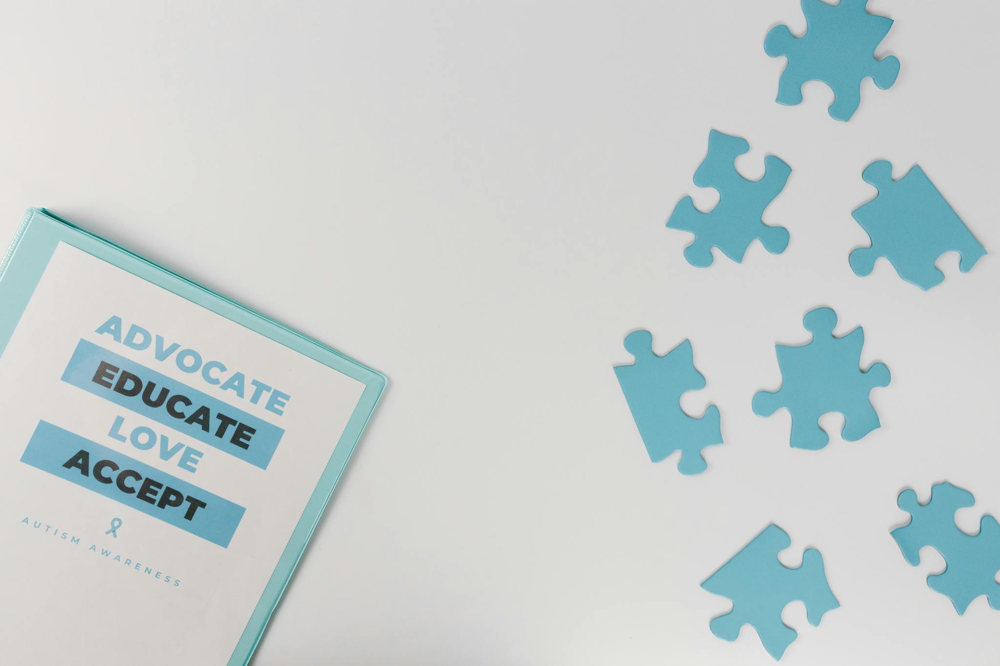 Blue puzzle pieces with advocacy messages for autism awareness.