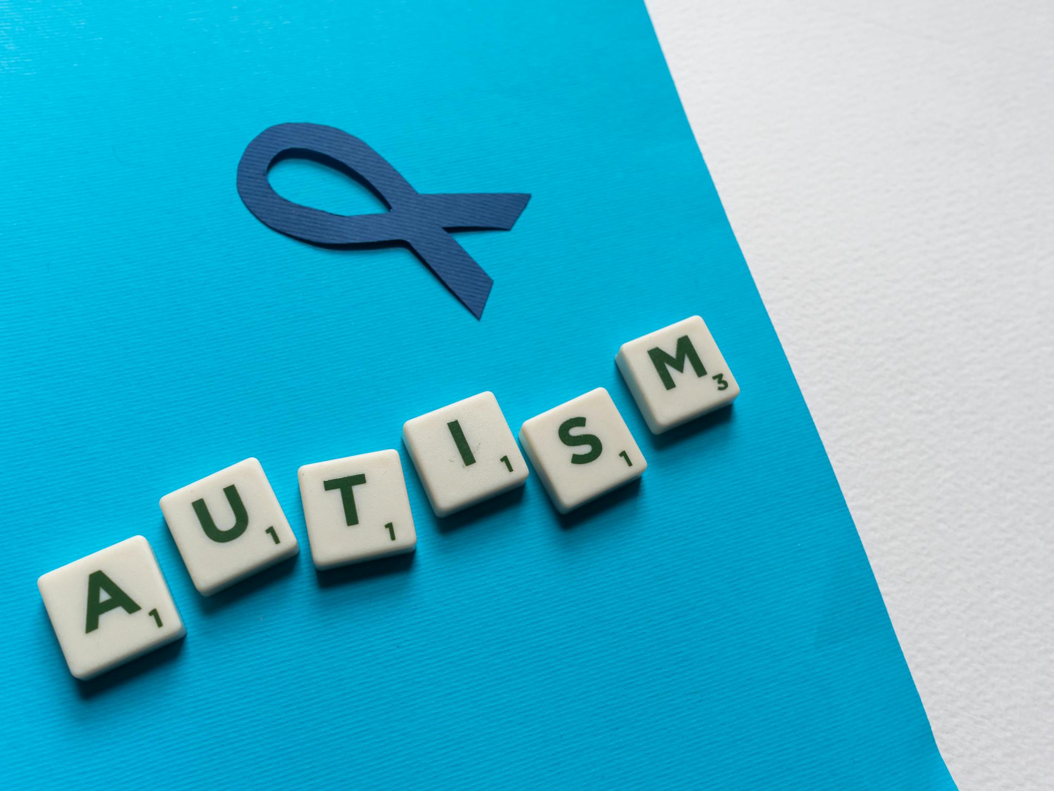 Close Up Of Autism Awareness Concept With Blue